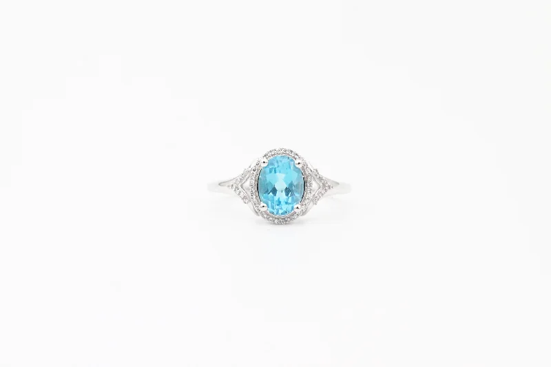 White Gold Oval Blue Topaz and Diamond Split Shank Halo Ring